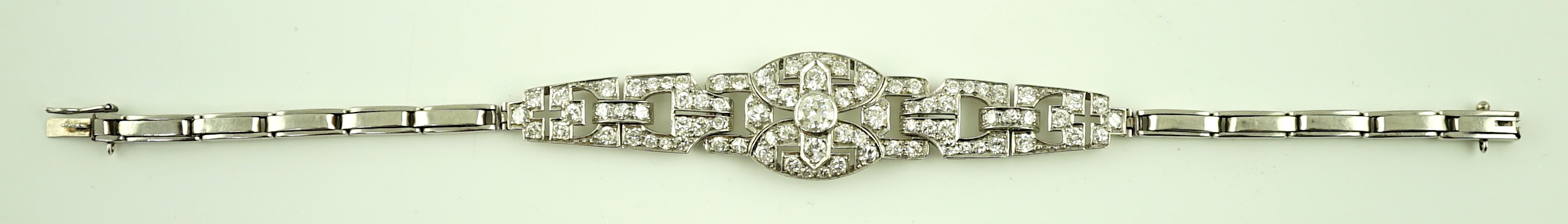 A 1950's platinum and diamond cluster set expanding link bracelet